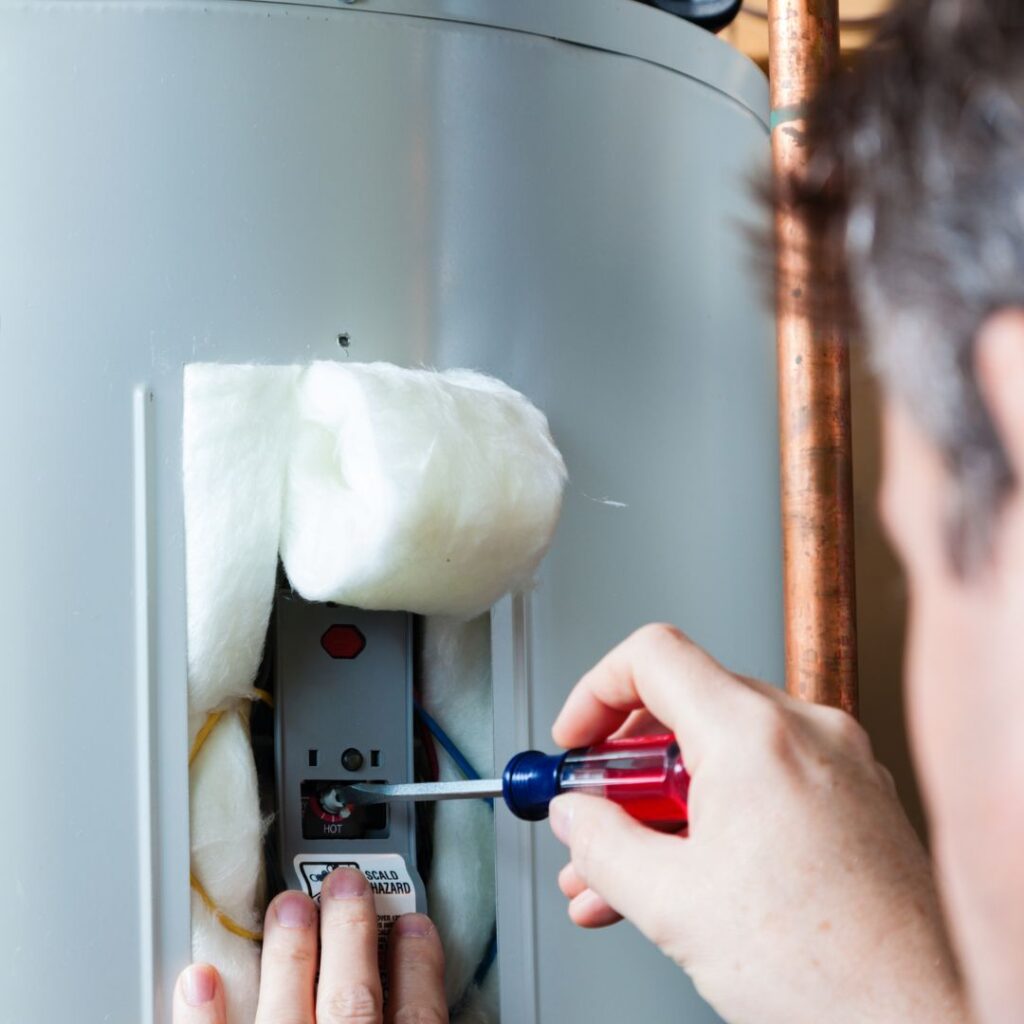 working on a hot water heater