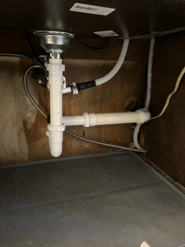 Clean new kitchen sink drain pipes after repair by Conner Plumbing